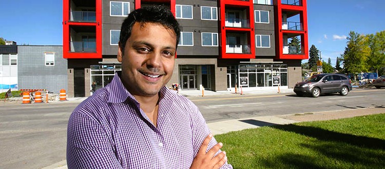 A man in front of a multi-storey