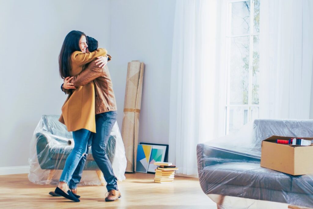 The girl and the guy are happy with the new house