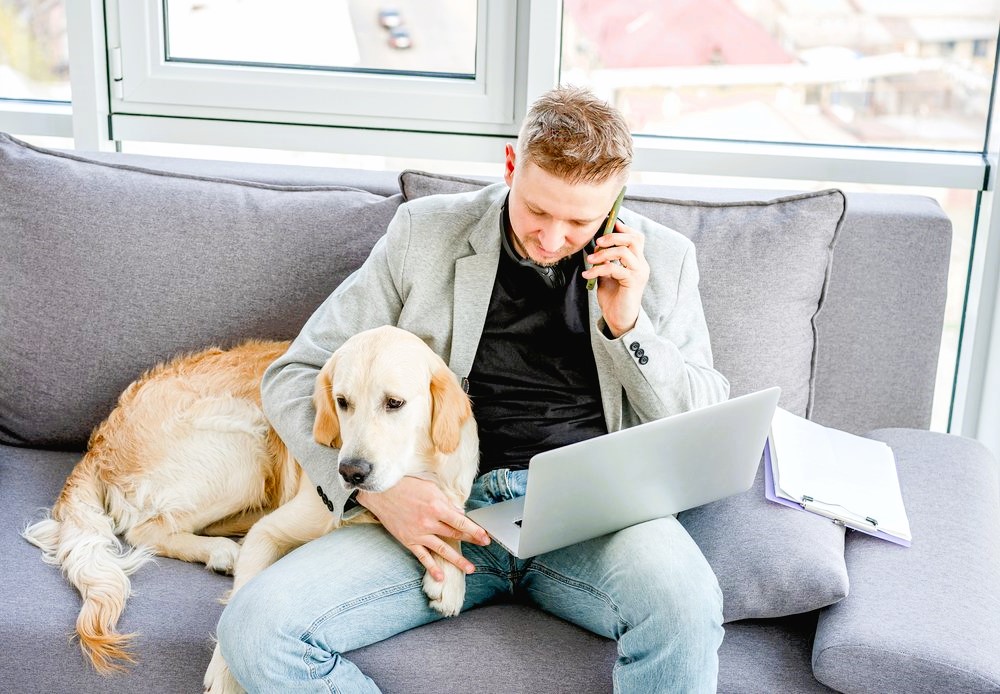 Guy with a dog on the couch